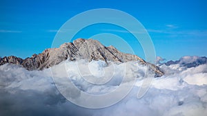 Mount Arera on the Orbie Alps above a sea of clouds