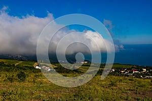 Mount Ayu Dag with clouds on the background of the Black Sea in the early morning