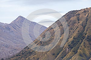 Mount Batok and Mount Widodaren in the Bromo mountain complex, East Java, Indonesia..