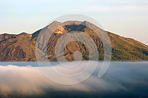 Mount Batur in the clouds at sunrise on Bali Indonesia