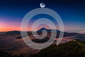 Mount Bromo volcano Gunung Bromo at sunrise with moon in Bromo Tengger Semeru National Park, East Java, Indonesia. Elements of