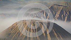 Mount Bromo Volcano during sunrise at Bromo-Tengger-Semeru National Park on Java Island, Indonesia.