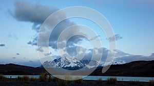 Mount Cerro Payne Grande and Torres del Paine at sunset time lapse. Nordenskjold Lake in Chile, Patagonia.