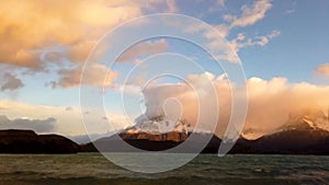 Mount Cerro Payne Grande and Torres del Paine at sunset time lapse. Nordenskjold Lake in Chile, Patagonia.