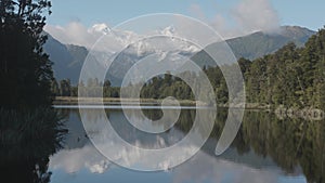 Mount. Cook and Mount. Tasman from Lake Matheson, New Zealand