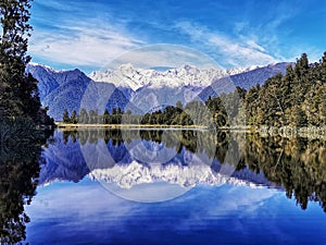 Mount Cook reflecting in the waters of the Lake Matheson on the South Island of New Zealand