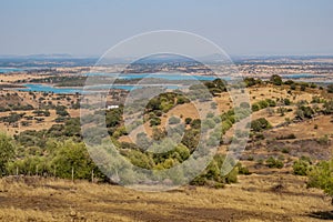 Mount with dried herbs, Alentejo landscape with Alqueva dam, Monsaraz PORTUGAL