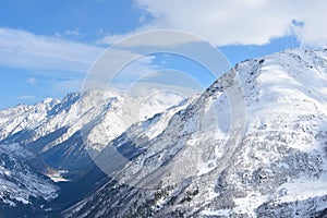 Mount Elbrus with ski slopes. Caucasus snowy mountains. Alpine skiing in the fresh air. skiers in the snow. mountain snowy landsca