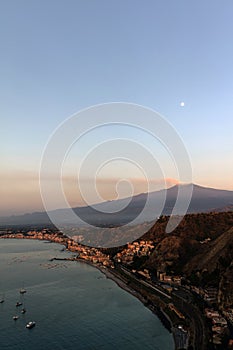 Mount Etna and the Giardini Naxos coastline at dawn