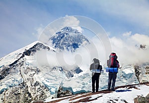 Mount Everest from Kala Patthar with two tourists