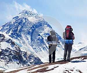 Mount Everest from Kala Patthar with two tourists