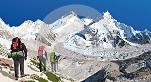 mount Everest Lhotse and Nuptse with three hikers