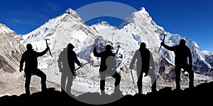Mount Everest and Lhotse and silhouette of climbers