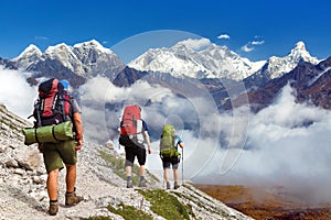 Mount Everest, Mt Ama Dablam, Lhotse peak, three hikers