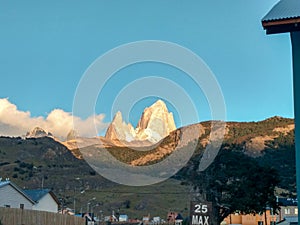 The Mount Fitz Roy in the gold hour over the blue sky