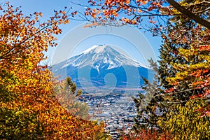 Mount Fuji framed with red maple leaves beautifully in autumn