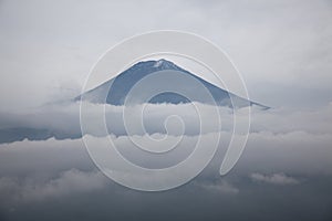 Mount Fuji summit over the clouds, Japan