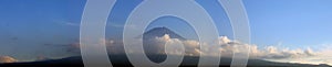 Mount Fuji surrounded by clouds - panorama