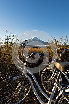 Mount Fuji view from Lake Kawaguchi with bicycles foreground, Yamanashi Prefecture, Japan.