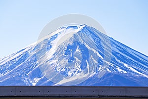 Mount Fuji world famous tourist attractions. snow cover on top with bright blue sky, bright is background.