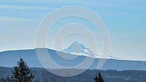 Mount Hood is Revealed Behind the Pine Trees a Drone Shot Opening a Scenery with Valley and Mountain with Plane