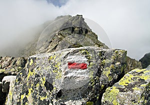 Mount Koprovsky stit and red tourist sign Vysoke Tatry