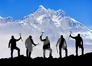Mount Lhotse silhouette climbers with ice axe in hand