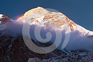 Mount Makalu with clouds, Nepal Himalayas mountains photo