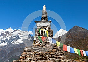 Mount Makalu with stone stupa and buddhist prayer flags