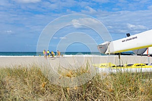 Members Mount Maunganui Surf Lifesavers club head down beach