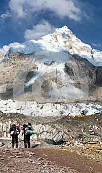 Mount Nuptse, mount Everest base camp and two toutists