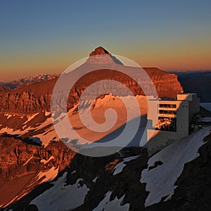 Mount Oldenhorn and Glacier 3000 summit station at sunset.