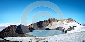 Mount ruapehu crater lake in summer with light snow