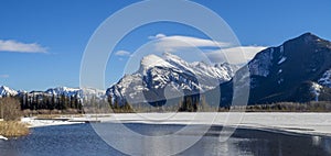 Mount Rundle reflected in the icy waters of Vermillion Lakes