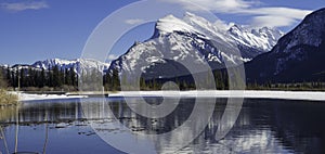 Mount Rundle reflected in the icy waters of Vermillion Lakes