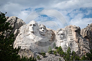 Mount Rushmore with blue sky and clouds