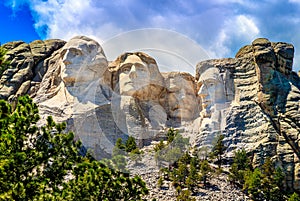 Mount Rushmore, cloudy with blue skies photo