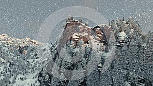 Mount Rushmore in winter, snowing