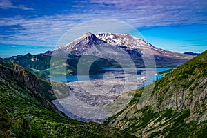 Mount Saint Helens and Spirit Lake filled with logs in the foreground