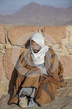 Mount Sinai , Mount Moses , Egypt - March 4,2019 : Portrait of a Bedouin Guide on the summit of Mount Sinai in Egypt