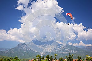 The Mount Tahtali in sunny day with paraglider near Tekirova, Turkey
