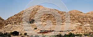 Mount of Temptation in the desert with acable car and the Monastery of Qurantul