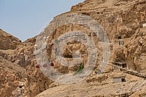 Mount of Temptation in the desert with a cable car and the Monastery of Qurantul