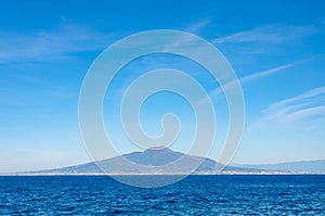 Mount Vesuvius on bluesky and Tyrrhenian Sea background. View from Sorrento on Amalfitan coast.