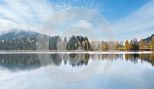 Mountain alpine autumn lake Schwarzsee, Kitzbuhel, Tirol, Austria Alps