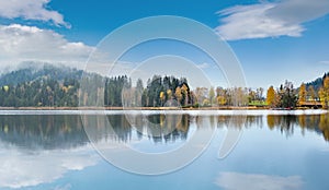 Mountain alpine autumn lake Schwarzsee, Kitzbuhel, Tirol, Austria Alps