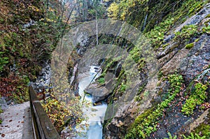 Mountain alpine autumn Wimbachklamm gorge and Wimbach stream with wooden path, Berchtesgaden national park, Alps, Bavaria, Germany