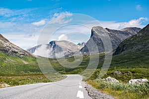 Mountain asphalt road surrounded by mountains, on the way to Trollstigen, Norway