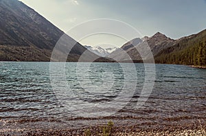 A mountain behind a blue lake