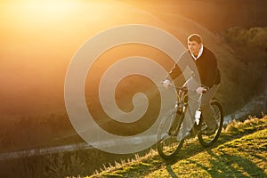 Mountain Bike cyclist riding single track at sunrise, healthy life